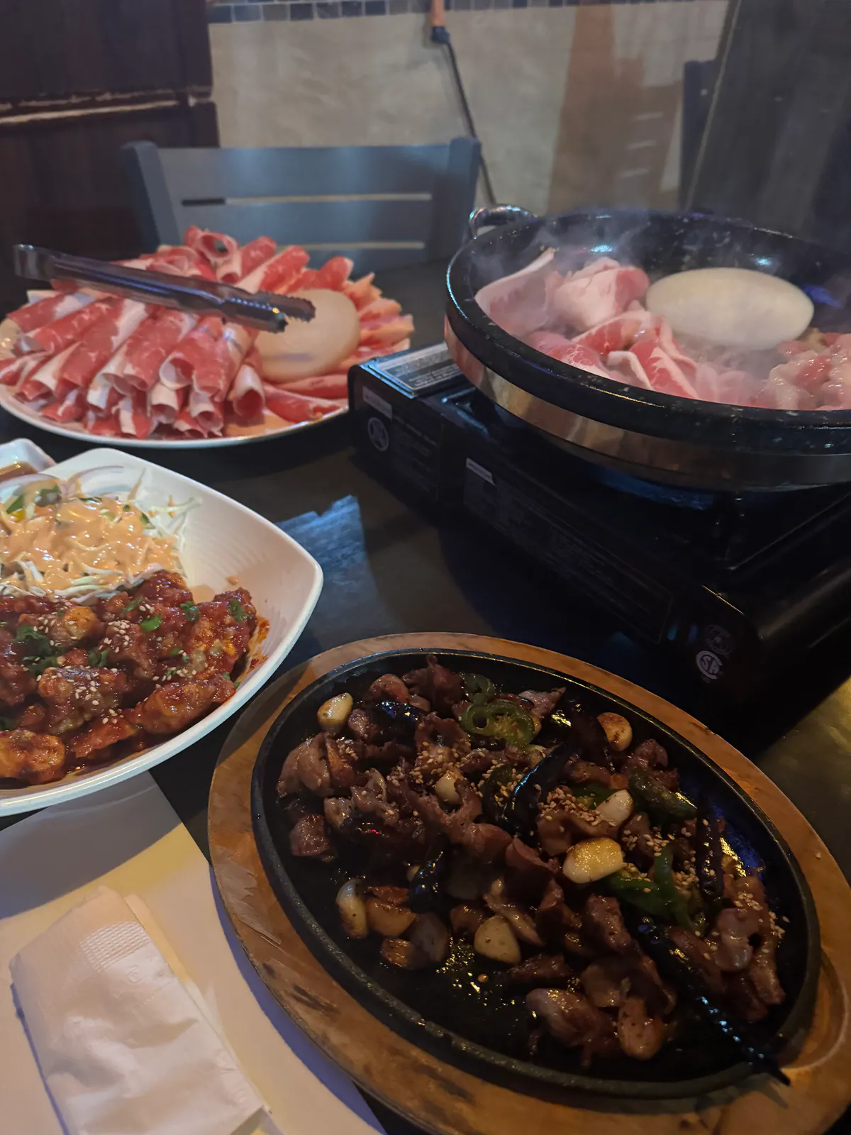 Hanshin Pocha table spread with hot pot and Korean dishes